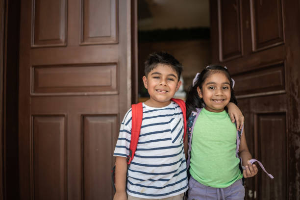 istock Portrait of a siblings at school 1414878841