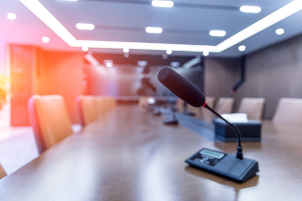 istock Empty conference room with microphones on the table 1414878907