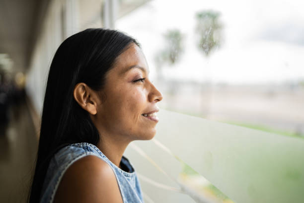 istock Young woman looking away contemplating 1414879921