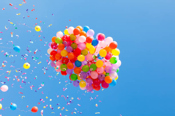 colorful balloons in the sky stock photo