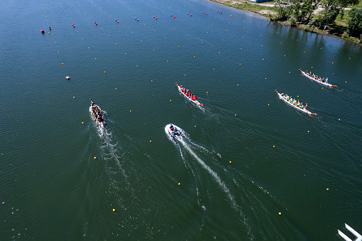 June 10, 2022. Barnaul Russia: dragon boat rowing competitions among teams on the rowing channel. top aerial view