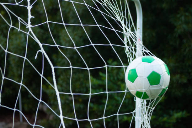 istock Soccer ball in the goal 1414889456