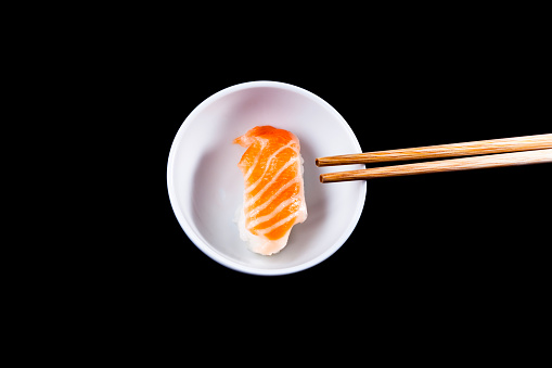 Salmon sushi and wooden chopsticks