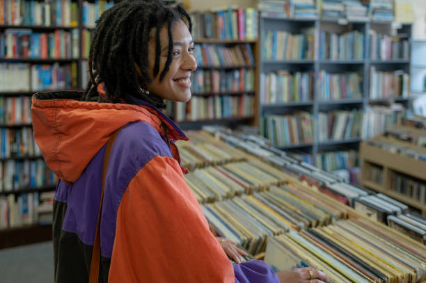 istock Woman searching through vinyl records 1414893669