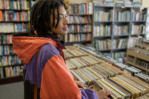 Woman seatching through records at local store