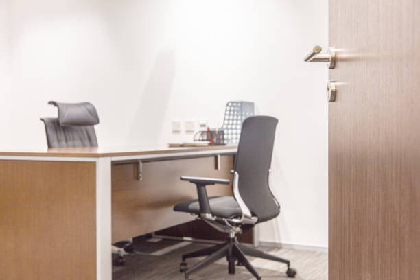 istock open wooden door and empty office 1414897362