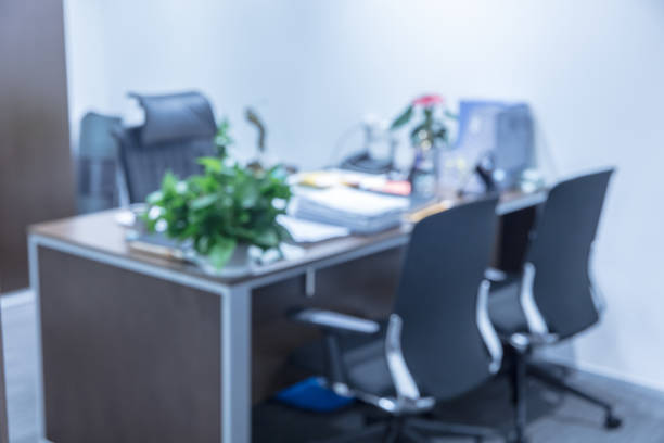 istock Empty office with three chairs and green plants, defocused blur effect 1414899719