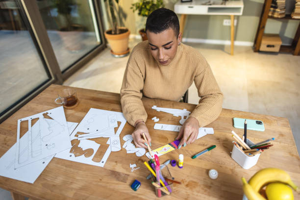 istock Young woman designer working at home 1414899734