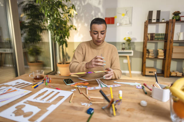 istock Young woman designer working at home 1414899740