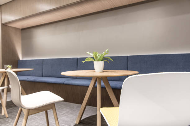 istock Empty cozy lounge area with round table and chairs 1414899881