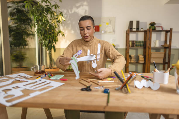 istock Making paper model of plane at home 1414899948