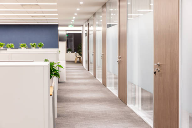 istock Office with closed wooden doors, corridor in modern office interior, empty 1414901629