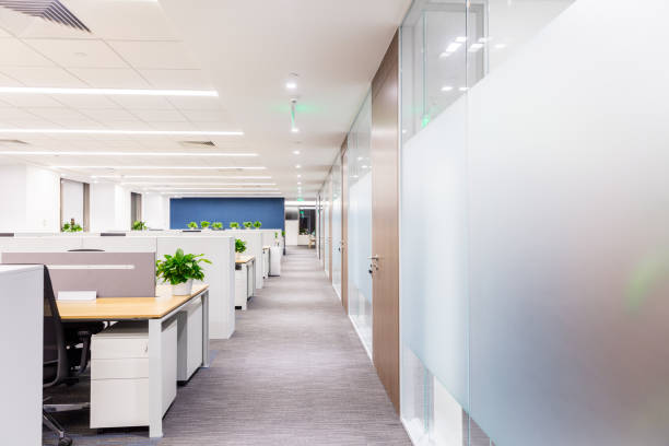 istock Modern style office interior with desk partition and separate office 1414903546