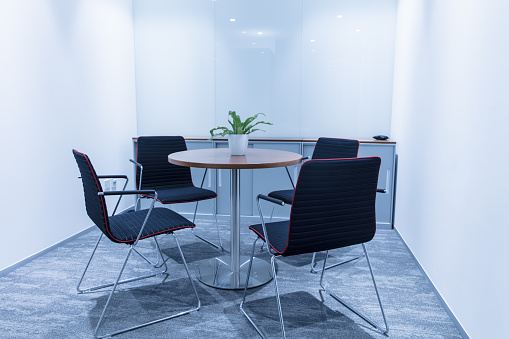 Empty office room with round table