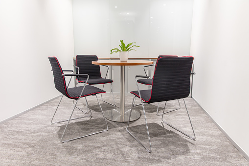 Conference room with round table and four chairs