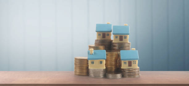istock Model of house savings plans for housing 1414906776