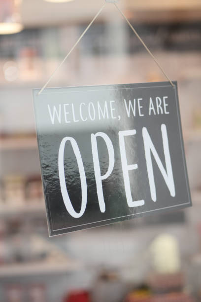 istock Open sign hanging front of cafe . 1414908171