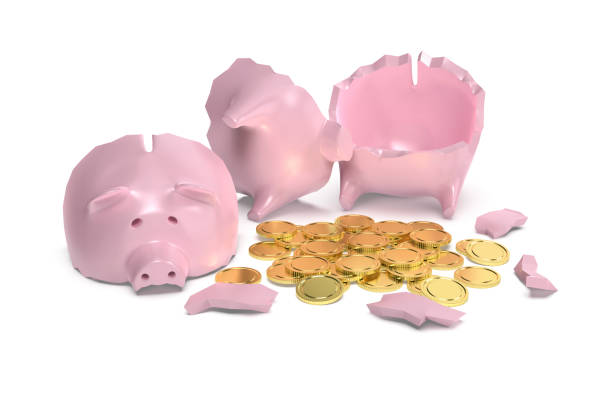 istock Broken piggy bank with gold coins 1414909942