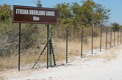Distance Sign to commercial safari lodge known as Etosha Oberland Lodge near Etosha National Park in Kunene Region, Namibia