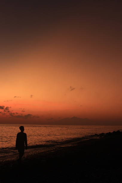 istock Stickman among the rising sun 1414915717