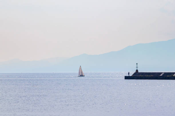 A small yacht floating off the harbor