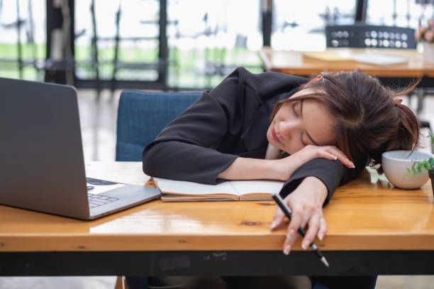 istock Burnout syndrome at work concept. exhausted overworked woman working in office.Concept Burnout Syndrome. 1414916169