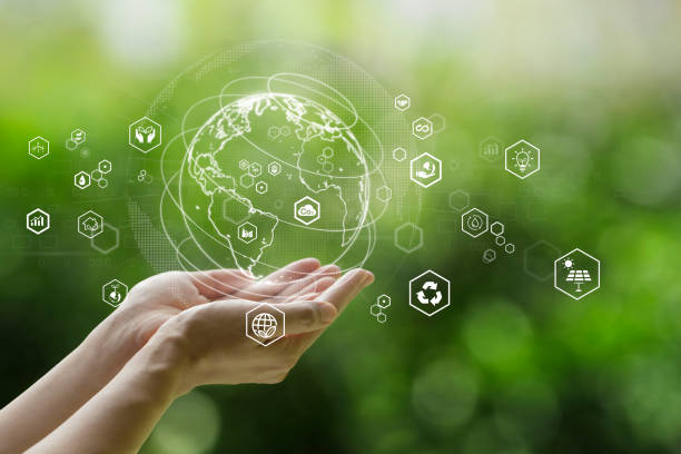 Sustainable development goal (SDGs) concept.Hands holding Global communication network with Environment icon on a green background.Green technology and Environmental technology.ESG stock photo