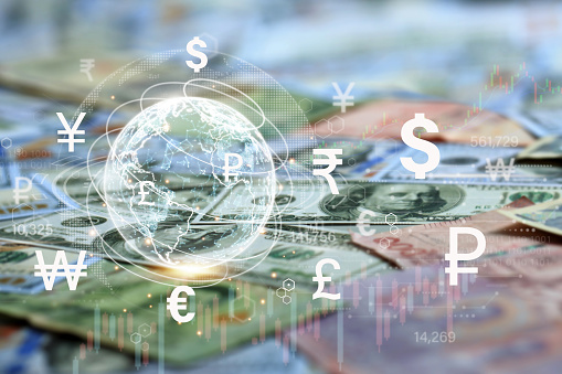 Global currency exchange and forex concept, world on international banknotes with virtual screen dollar yuan yen euro and pound sterling sign for money transfer and trade forex concept.Money transfer.