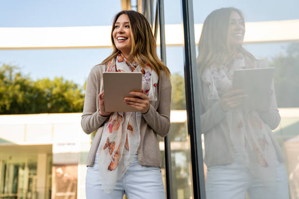 istock Digital device people work social media student concept. Happy young woman using digital tablet 1414918871