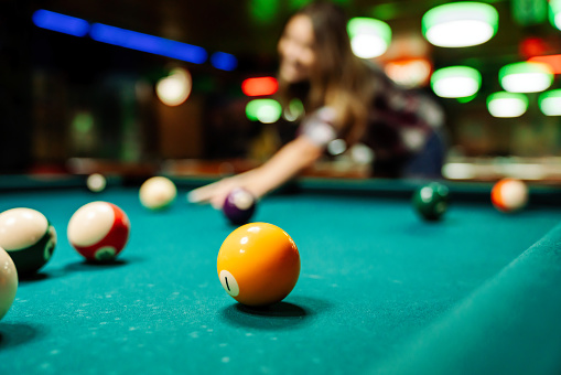 Colorful pool balls on a pool table set in a triangle