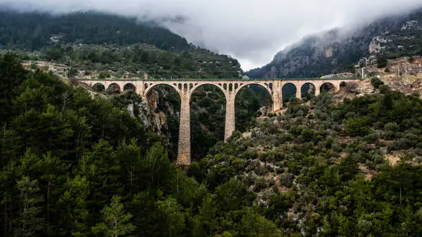 Photo of Aerial view of Stone bridge railway, Varda railway bridge, the bridge in the James Bond movie, Adana taskopru, bridge for train, empty bridge,