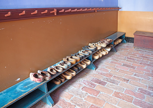 Vintage wooden shoes waiting for their owner, selective focus