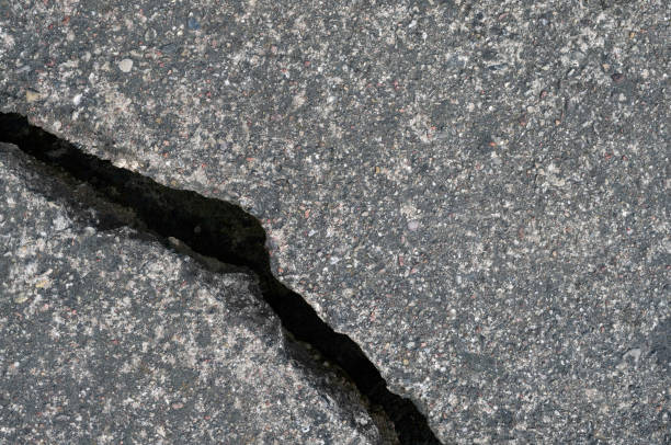 istock Old aged weathered cracked grey black tarmac texture pattern, large detailed damaged textured asphalt grungy background flat lay, horizontal rough grained broken pattern macro closeup grunge copy space 1414925624