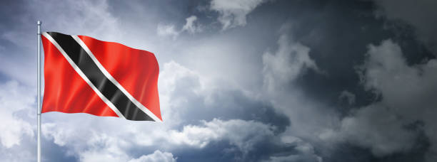 istock Trinidad And Tobago flag on a cloudy sky 1414925801