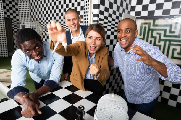 istock Four friends solving puzzles in quest room 1414926249