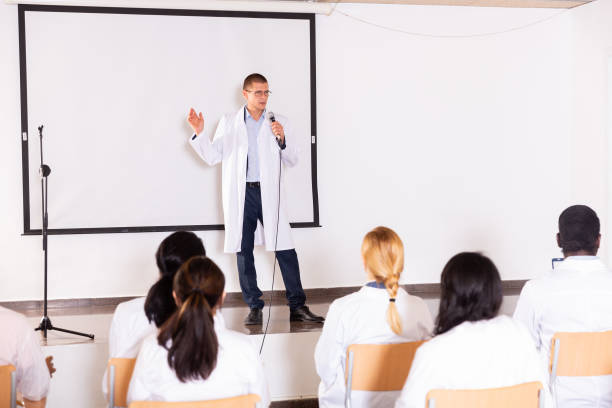 istock Male coach giving speech at conference hall 1414927159