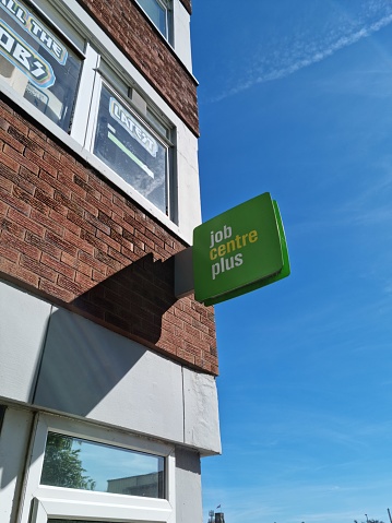 The green square Job Centre Plus sign mounted on an office block.