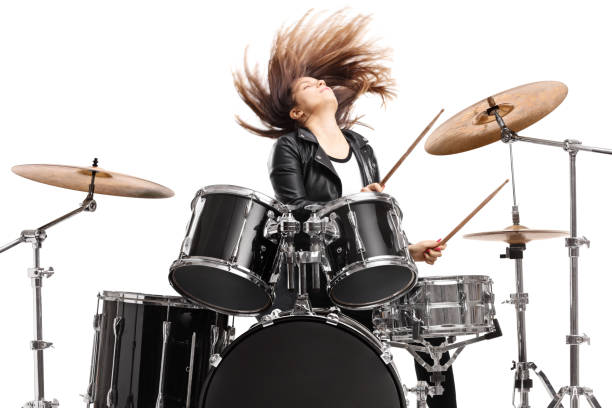 istock Young female drummer throwing her hair and playing drums 1414932987