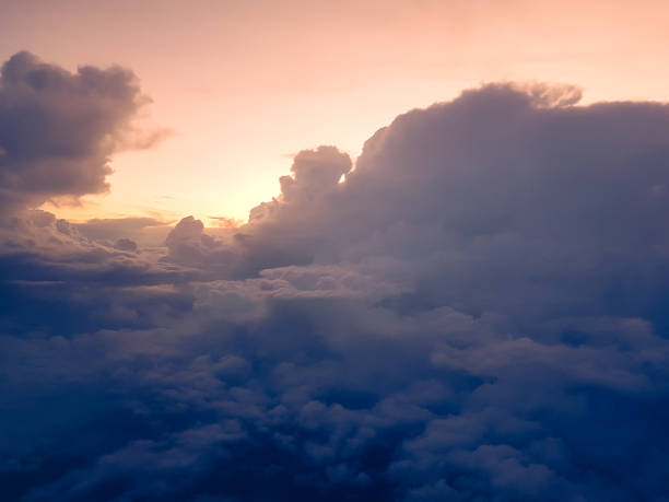 istock Stunning sunny sunset among the clouds, view from the sky 1414937239