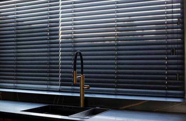 istock Wood blinds black color closeup on the window. 1414938339