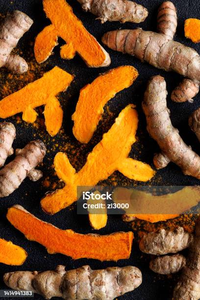 Fresh Turmeric Curcuma Roots On A Black Background Stock Photo - Download Image Now
