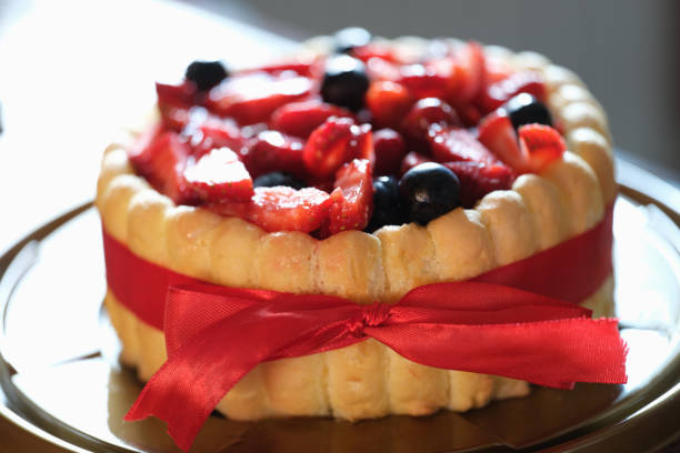 istock Fresh berry sweet fresh pie with red ribbon 1414942512