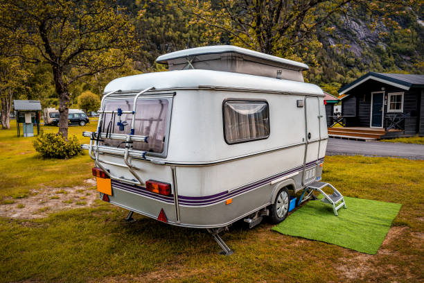 istock Camping trailer stands in campsite 1414943999
