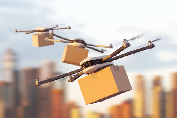 istock Delivery drones flying with carton boxes on city background. Mockup 1414945400
