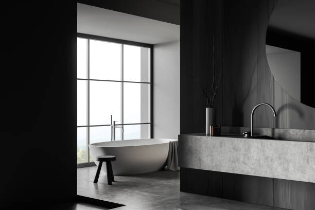 istock Grey bathroom interior with washbasin and tub, panoramic window 1414945617