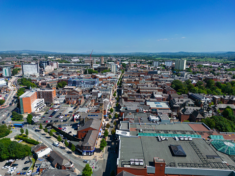 high aspect aerial view of Fishergate main street and over the town cityscape of Preston, Lancashire, England