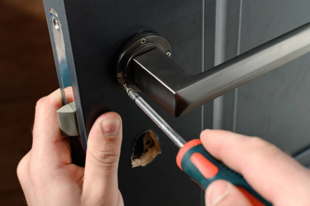 istock Installation of a door handle on interior doors, carpentry work with doors. 1414946037