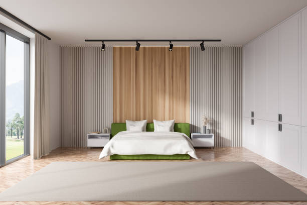istock Light bedroom interior with bed near panoramic window 1414946224