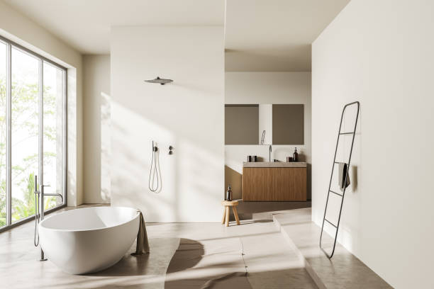 istock Light bathroom interior with bathtub, douche, sink and panoramic window 1414946324