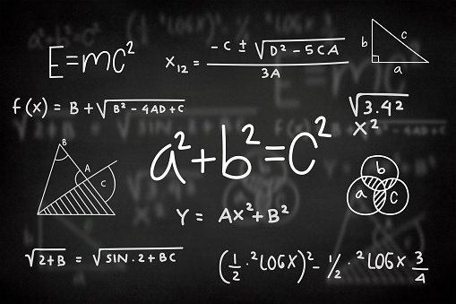 Mathematical formula on a black chalkboard